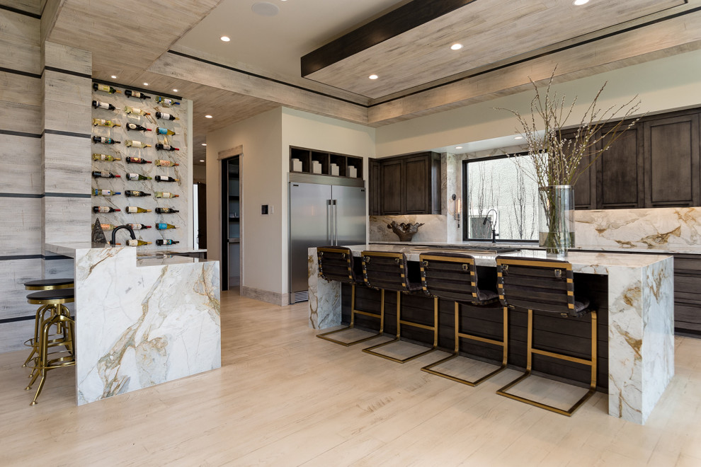 This is an example of a contemporary l-shaped kitchen in Kansas City with shaker cabinets, dark wood cabinets, white splashback, stainless steel appliances, light hardwood flooring, an island, beige floors, white worktops, a drop ceiling and a wood ceiling.