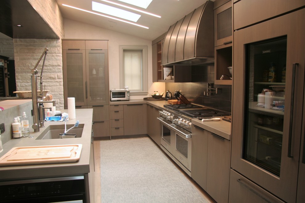 Inspiration for a mid-sized modern l-shaped light wood floor open concept kitchen remodel in Denver with an undermount sink, flat-panel cabinets, an island, brown cabinets, zinc countertops, gray backsplash, porcelain backsplash and stainless steel appliances