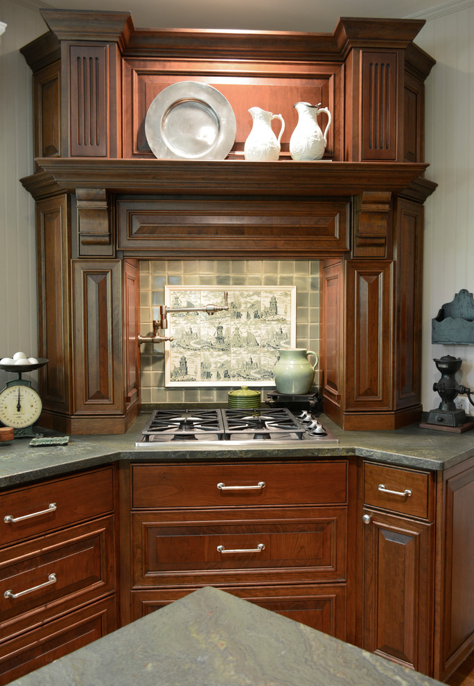 Example of a mid-sized classic l-shaped medium tone wood floor eat-in kitchen design in Atlanta with an undermount sink, raised-panel cabinets, medium tone wood cabinets, gray backsplash, ceramic backsplash, stainless steel appliances and an island