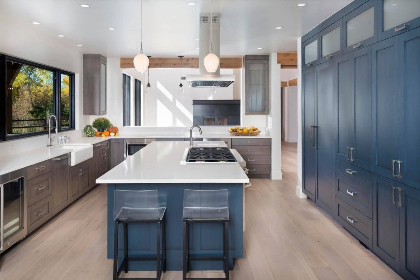 Spacious L-Shaped Kitchen Design With Tinted Aqua-Blue Cabinets