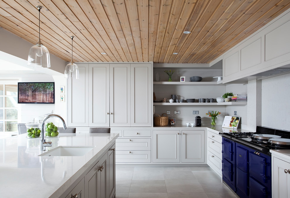 Inspiration for a rural kitchen in Dublin with recessed-panel cabinets, white cabinets, composite countertops and white floors.