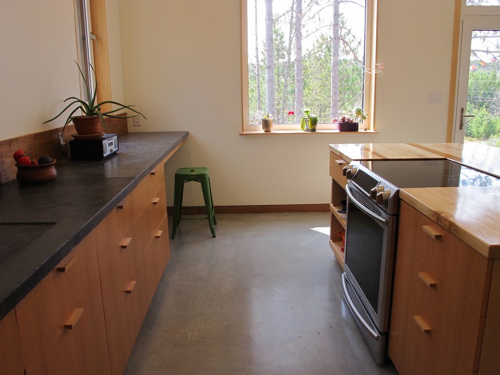 Large modern l-shaped kitchen in Ottawa with a submerged sink, flat-panel cabinets, medium wood cabinets, concrete worktops, wood splashback, stainless steel appliances, concrete flooring and an island.