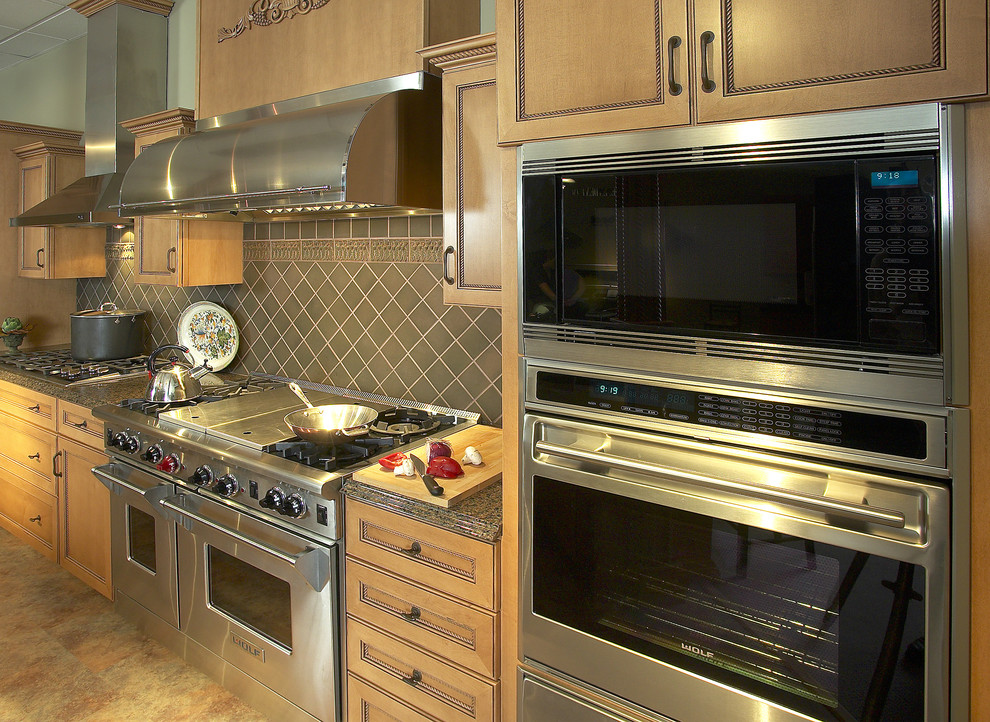 Inspiration for a mid-sized timeless single-wall ceramic tile enclosed kitchen remodel in Boston with stainless steel appliances, gray backsplash, recessed-panel cabinets, medium tone wood cabinets, granite countertops, ceramic backsplash and no island