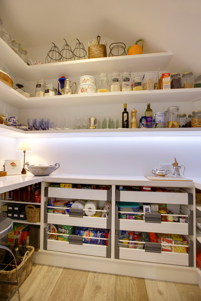 Large nautical single-wall kitchen pantry in Melbourne with a double-bowl sink, beaded cabinets, white cabinets, composite countertops, mosaic tiled splashback, stainless steel appliances, plywood flooring and an island.