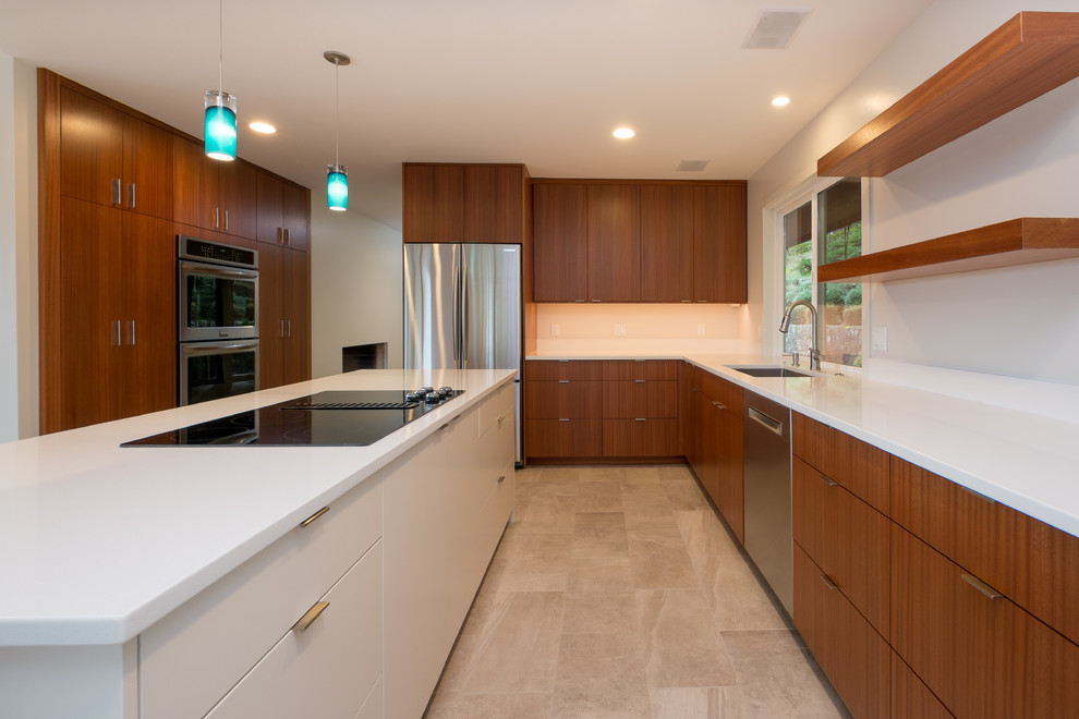 Design ideas for a large modern l-shaped kitchen/diner in Portland with a submerged sink, flat-panel cabinets, medium wood cabinets, engineered stone countertops, stainless steel appliances, porcelain flooring and an island.