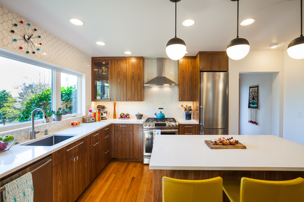 Example of a mid-century modern kitchen design in Portland