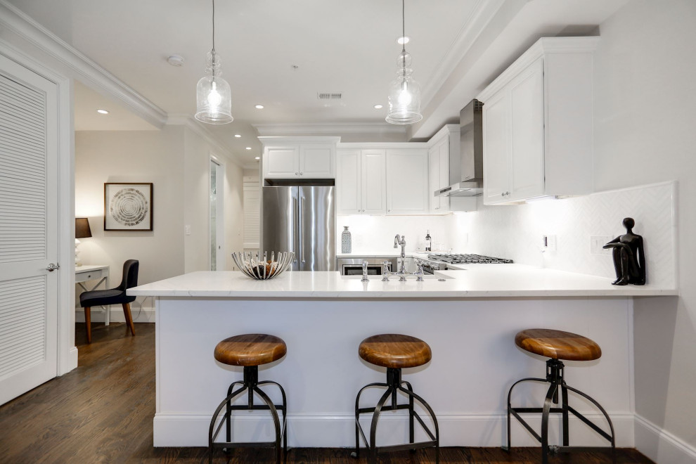 Inspiration for a small timeless u-shaped dark wood floor and brown floor open concept kitchen remodel in DC Metro with a farmhouse sink, recessed-panel cabinets, white cabinets, quartzite countertops, white backsplash, marble backsplash, stainless steel appliances, no island and white countertops