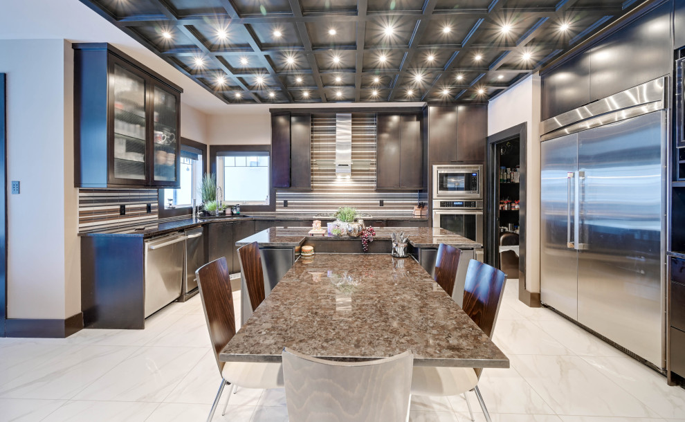 Design ideas for a contemporary u-shaped kitchen/diner in Edmonton with a submerged sink, flat-panel cabinets, dark wood cabinets, multi-coloured splashback, stainless steel appliances, an island, white floors, brown worktops and a coffered ceiling.