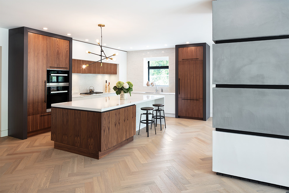 Inspiration for a contemporary light wood floor kitchen remodel in Vancouver with flat-panel cabinets, dark wood cabinets, quartz countertops, white backsplash, an island and white countertops