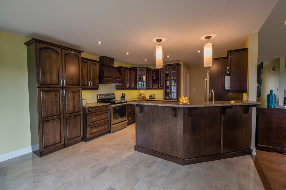 This is an example of a large classic l-shaped kitchen/diner in Other with a double-bowl sink, raised-panel cabinets, dark wood cabinets, granite worktops, yellow splashback, stainless steel appliances, ceramic flooring and a breakfast bar.