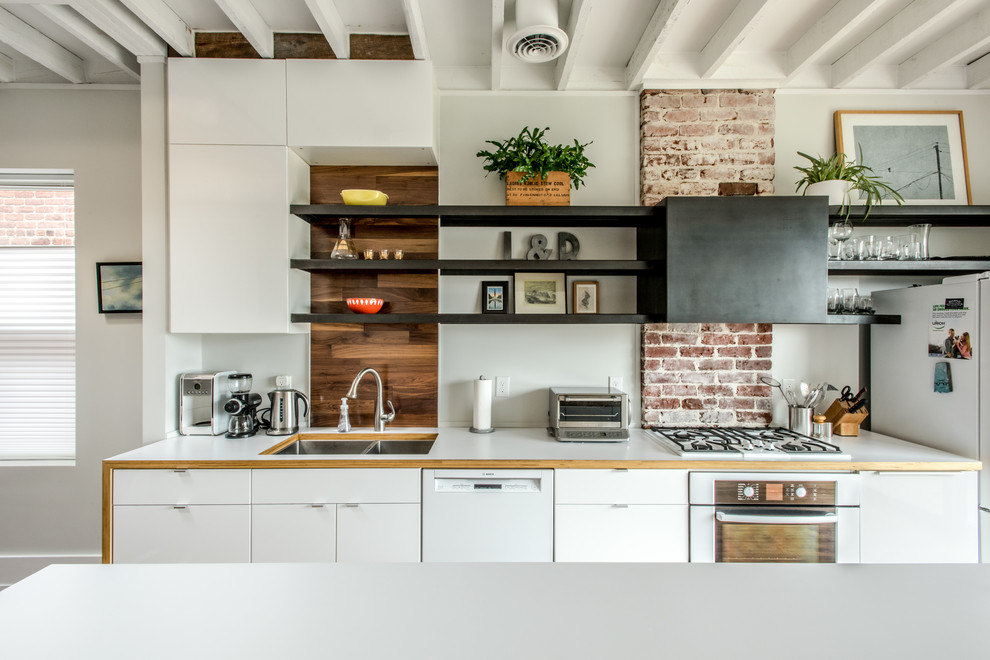 Example of a trendy kitchen design in Richmond with a double-bowl sink, flat-panel cabinets, white cabinets and white appliances