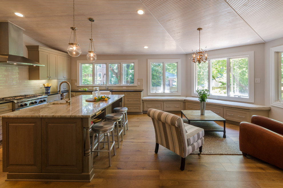 Inspiration for a mid-sized transitional l-shaped dark wood floor kitchen remodel in Richmond with a farmhouse sink, medium tone wood cabinets, granite countertops, white backsplash, subway tile backsplash, stainless steel appliances and an island