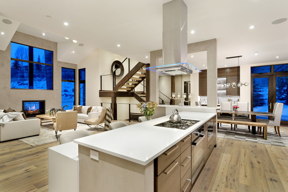 Example of a large trendy u-shaped light wood floor and beige floor eat-in kitchen design in Denver with an undermount sink, flat-panel cabinets, dark wood cabinets, quartzite countertops, gray backsplash, window backsplash, stainless steel appliances, an island and white countertops
