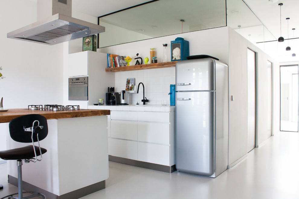 Example of an eclectic kitchen design in Amsterdam