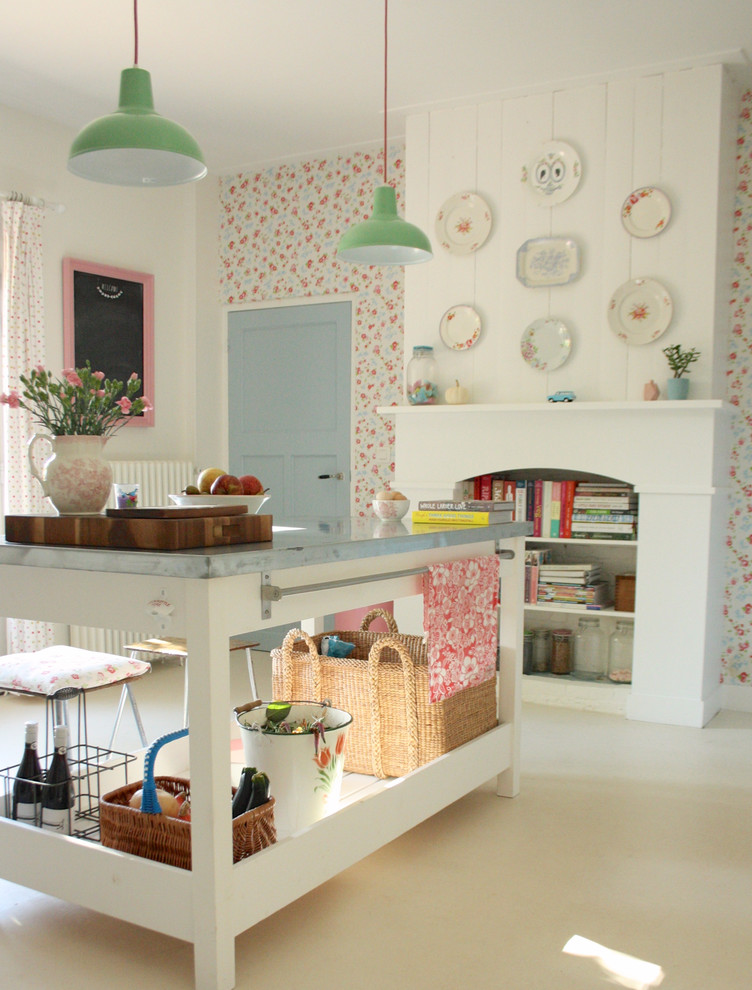 Cottage chic kitchen photo in Amsterdam with white cabinets and zinc countertops