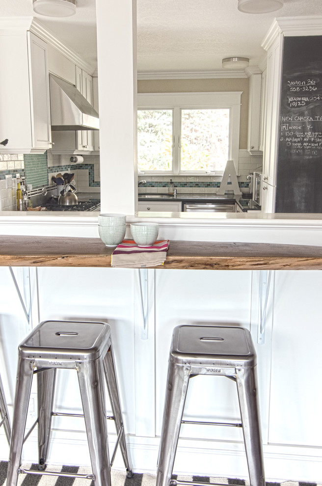 Trendy kitchen photo in San Francisco with wood countertops