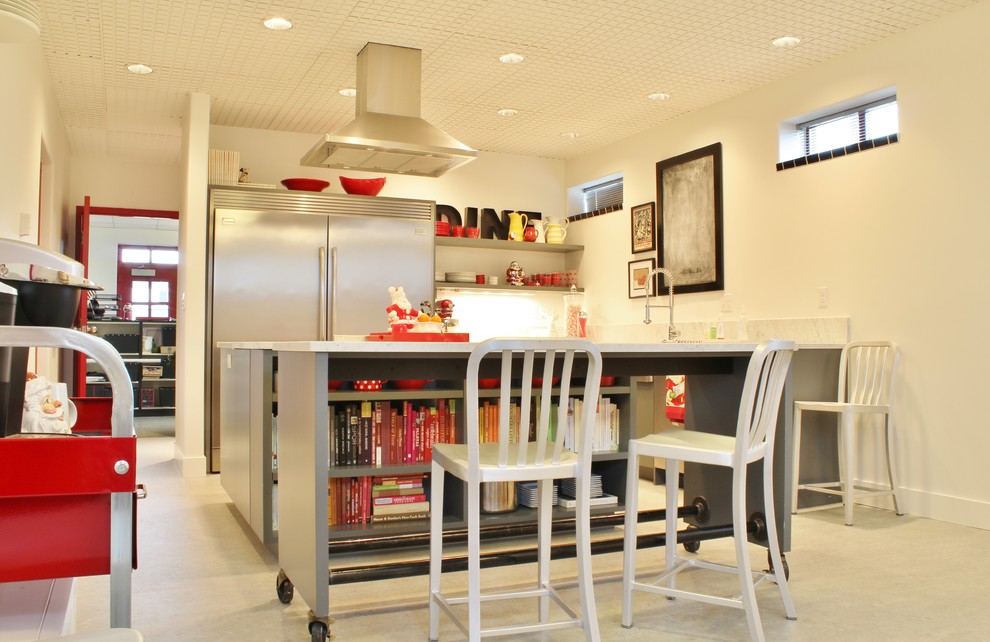 Inspiration for an industrial u-shaped enclosed kitchen remodel in Seattle with open cabinets and stainless steel appliances