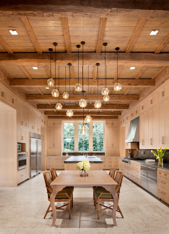 Inspiration for a medium sized rustic l-shaped enclosed kitchen in Houston with an integrated sink, shaker cabinets, beige cabinets, engineered stone countertops, grey splashback, stone slab splashback, stainless steel appliances, travertine flooring, an island and beige floors.