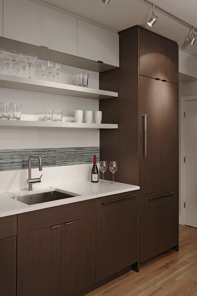 Eat-in kitchen - modern single-wall medium tone wood floor eat-in kitchen idea in DC Metro with a drop-in sink, flat-panel cabinets, medium tone wood cabinets, stainless steel appliances, no island, quartz countertops, multicolored backsplash and porcelain backsplash