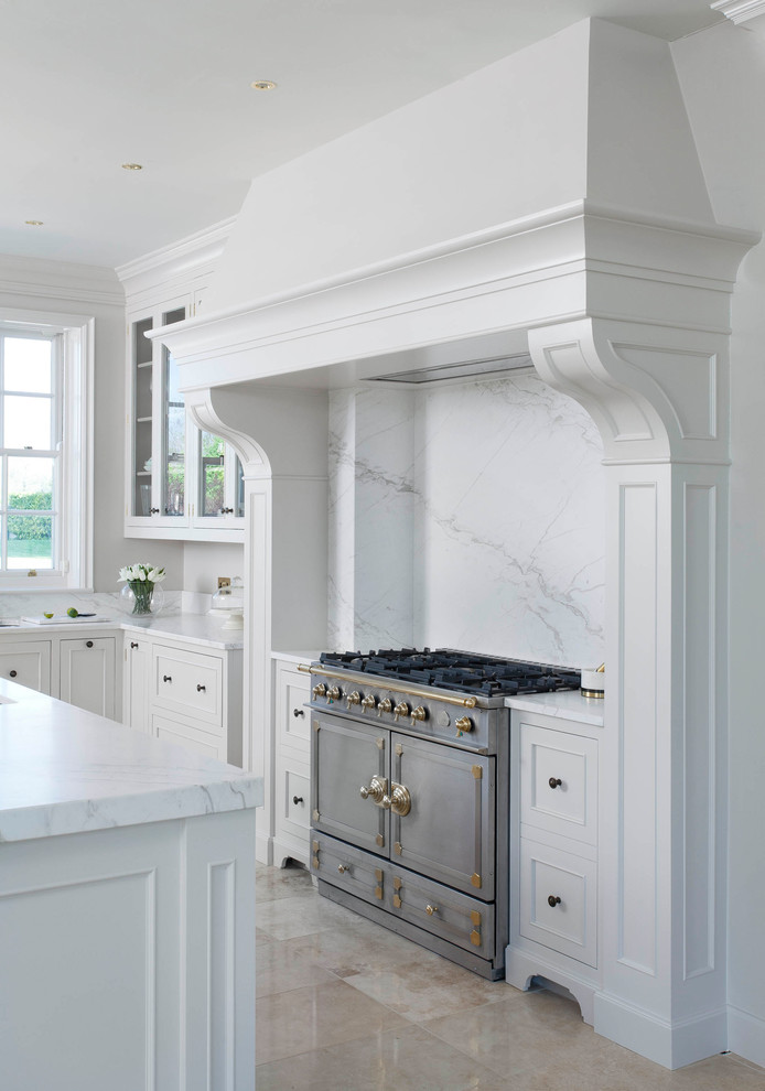 Inspiration for a large classic u-shaped open plan kitchen in Other with a built-in sink, beaded cabinets, white cabinets, marble worktops, white splashback, marble splashback, stainless steel appliances, porcelain flooring, an island, beige floors and yellow worktops.