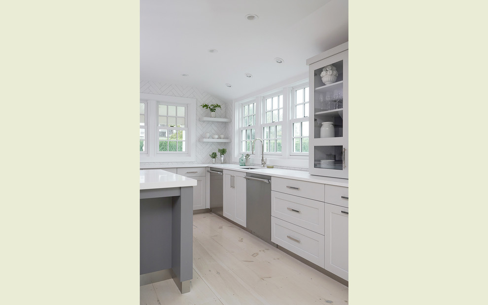 Kitchen - transitional light wood floor and white floor kitchen idea with an undermount sink, beaded inset cabinets, white cabinets, quartz countertops, white backsplash, ceramic backsplash, stainless steel appliances, an island and white countertops