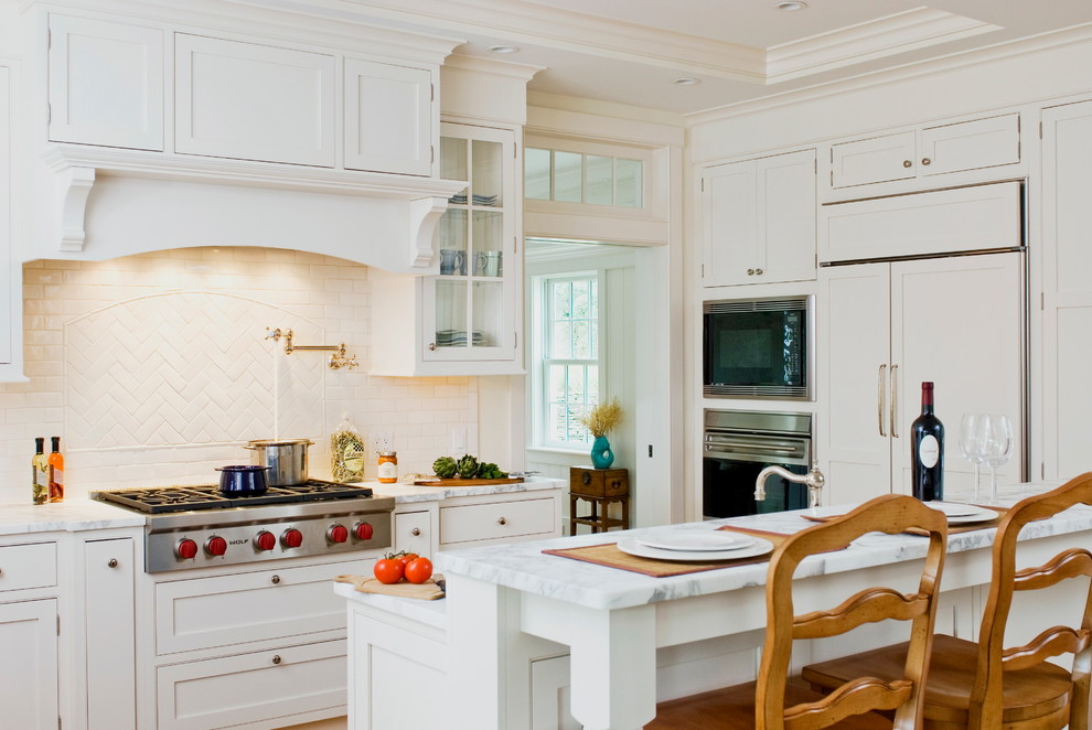 Photo of a traditional kitchen in Philadelphia with shaker cabinets and stainless steel appliances.