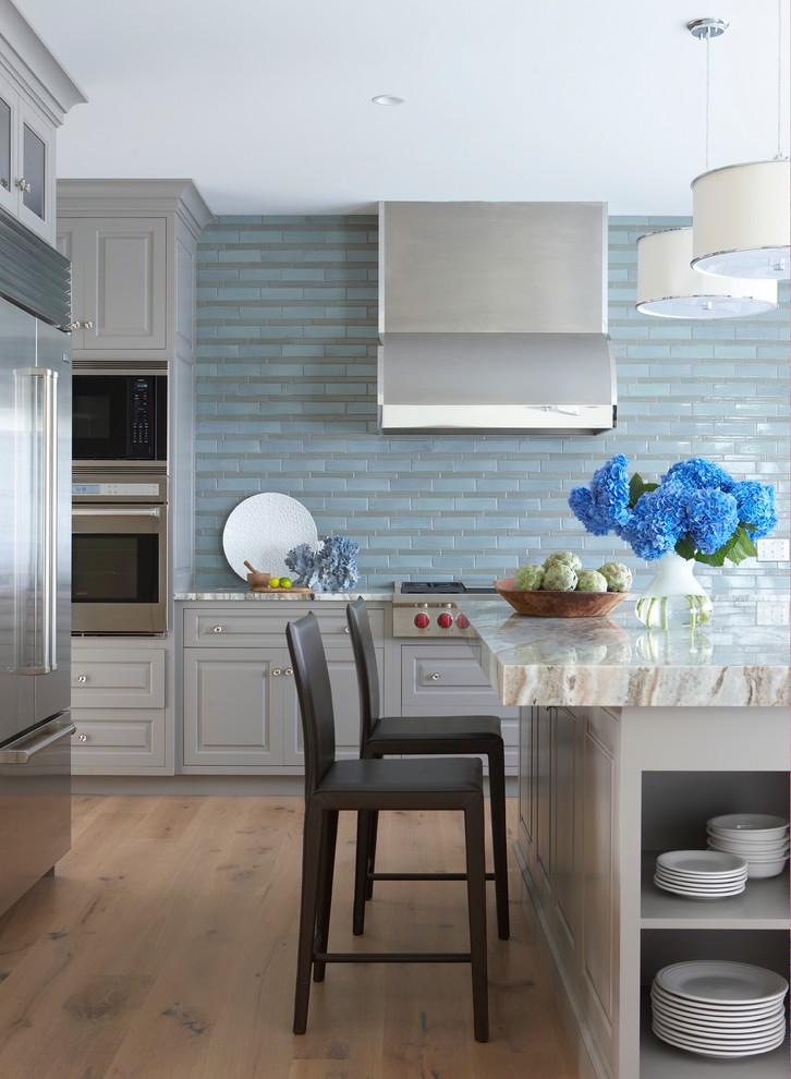 Inspiration for a coastal kitchen remodel in Boston with raised-panel cabinets, gray cabinets, marble countertops, blue backsplash and stainless steel appliances