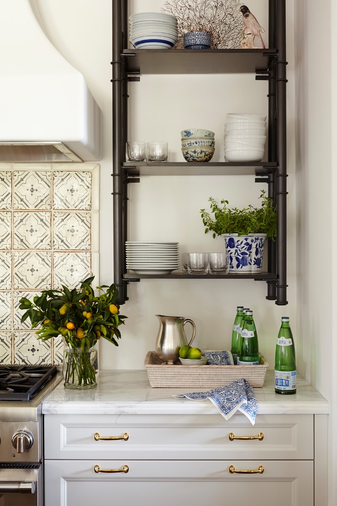 Eat-in kitchen - large tropical single-wall dark wood floor eat-in kitchen idea in Miami with an undermount sink, shaker cabinets, white cabinets, marble countertops, white backsplash, cement tile backsplash, paneled appliances and an island