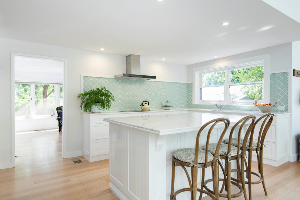 Inspiration for a mid-sized contemporary l-shaped light wood floor open concept kitchen remodel in Canberra - Queanbeyan with a drop-in sink, shaker cabinets, white cabinets, green backsplash, an island, marble countertops and porcelain backsplash