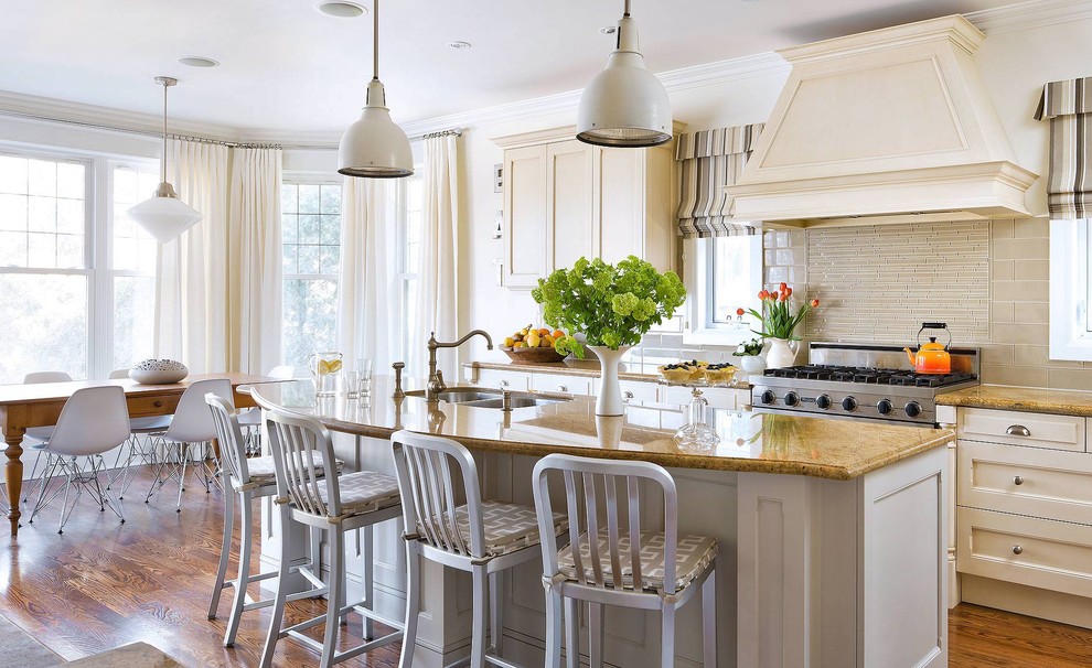 Elegant eat-in kitchen photo in Toronto with a double-bowl sink, recessed-panel cabinets, white cabinets, beige backsplash and matchstick tile backsplash