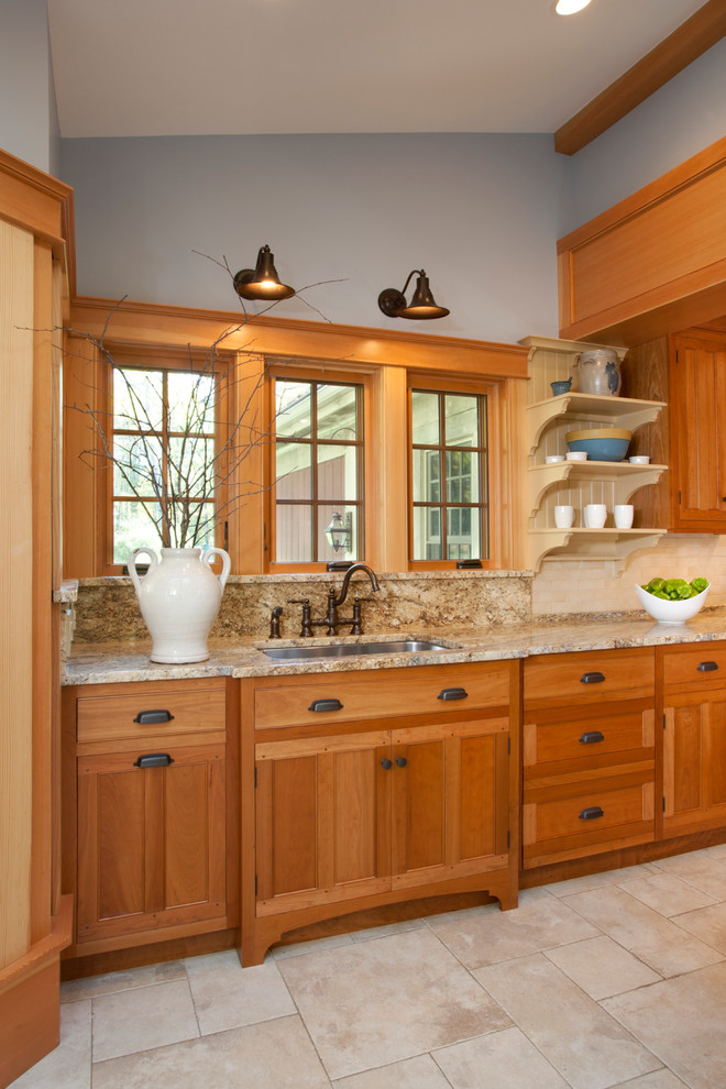 Eat-in kitchen - craftsman ceramic tile eat-in kitchen idea in Other with an undermount sink, medium tone wood cabinets, granite countertops, yellow backsplash, ceramic backsplash, paneled appliances and an island
