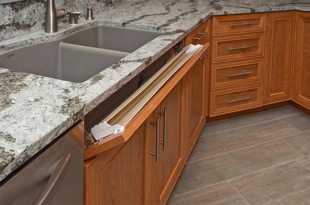 Inspiration for a mid-sized timeless u-shaped ceramic tile eat-in kitchen remodel in Other with an undermount sink, recessed-panel cabinets, medium tone wood cabinets, glass countertops and stainless steel appliances