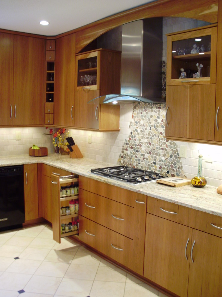 Example of a minimalist u-shaped eat-in kitchen design in Other with an undermount sink, flat-panel cabinets, light wood cabinets, granite countertops, beige backsplash, stone tile backsplash and stainless steel appliances