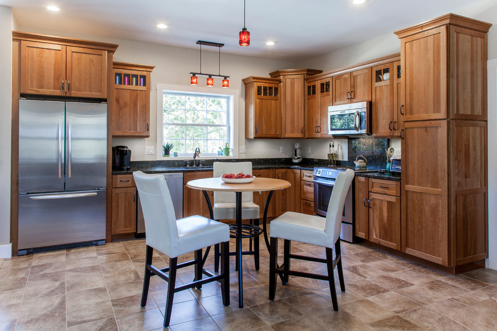 Natural Cherry Shaker kitchen with dark granite countertops
