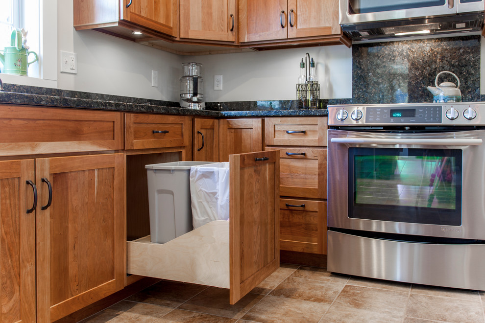 Natural Cherry Shaker kitchen with dark granite countertops