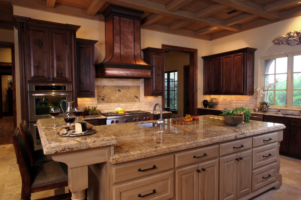 Example of a tuscan kitchen design in Dallas