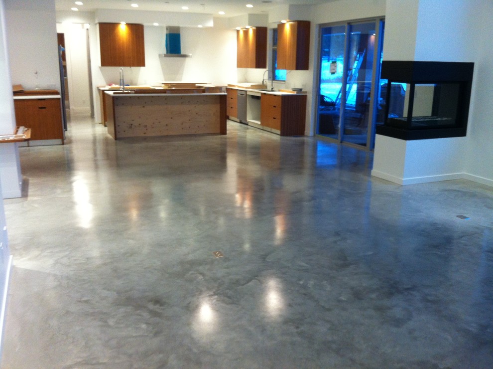 Immagine di una cucina minimal con pavimento in cemento