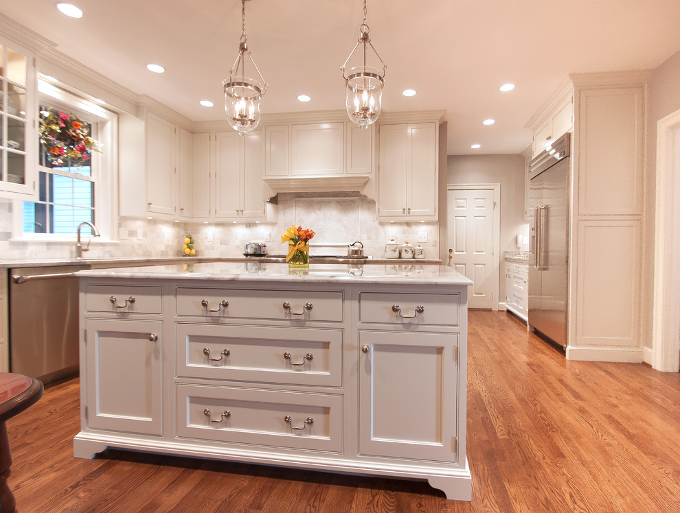 Example of a trendy medium tone wood floor kitchen design in DC Metro with beaded inset cabinets, white cabinets, granite countertops, stainless steel appliances and an island