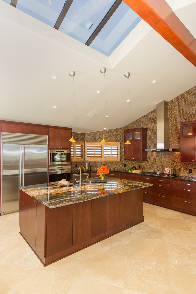 This is an example of a large contemporary l-shaped kitchen/diner in Orange County with a single-bowl sink, flat-panel cabinets, brown cabinets, granite worktops, brown splashback, glass tiled splashback, stainless steel appliances, marble flooring and an island.