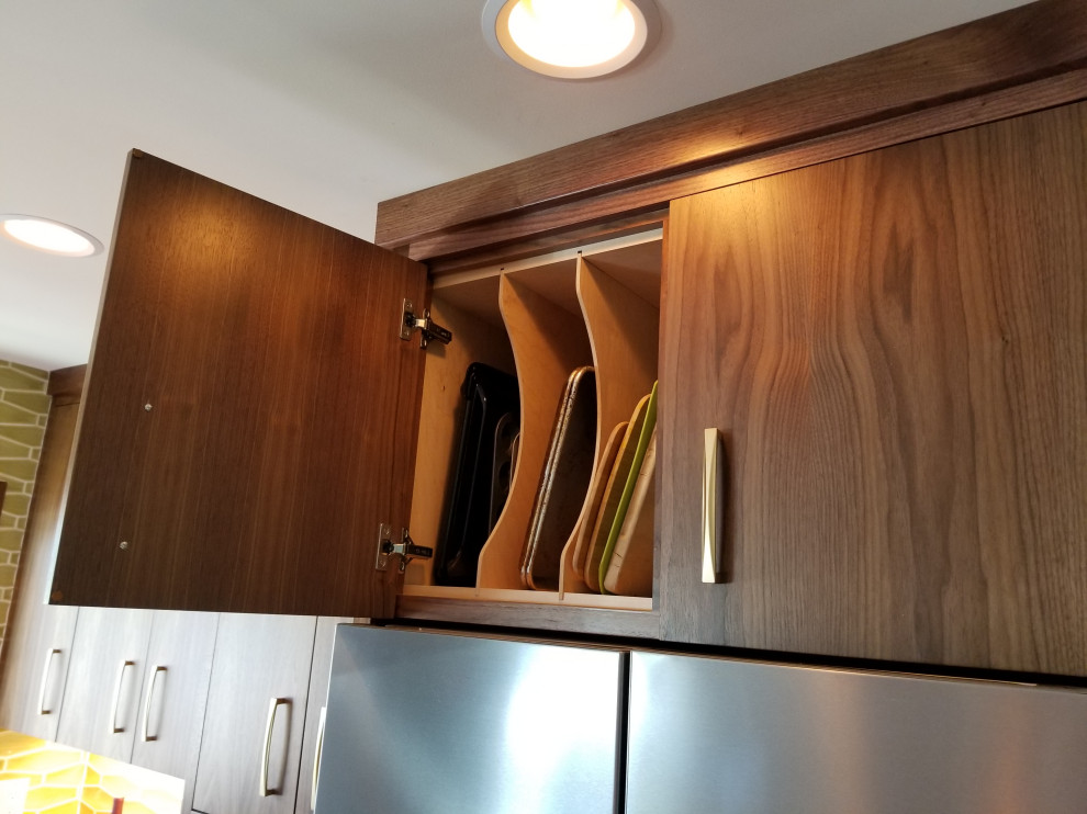 Inspiration for a large midcentury u-shaped kitchen in Boise with a double-bowl sink, flat-panel cabinets, dark wood cabinets, engineered stone countertops, ceramic splashback, stainless steel appliances, medium hardwood flooring, an island and white worktops.