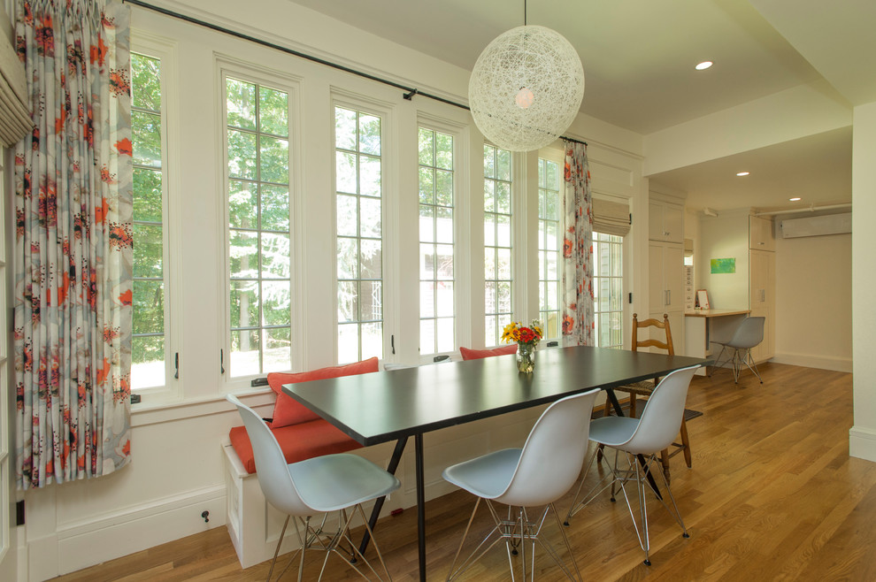 Example of a mid-sized transitional medium tone wood floor kitchen/dining room combo design in Boston
