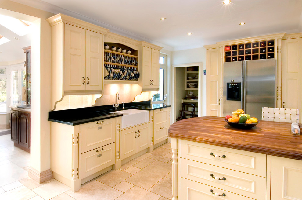 This is an example of a classic kitchen in Other with a belfast sink and stainless steel appliances.