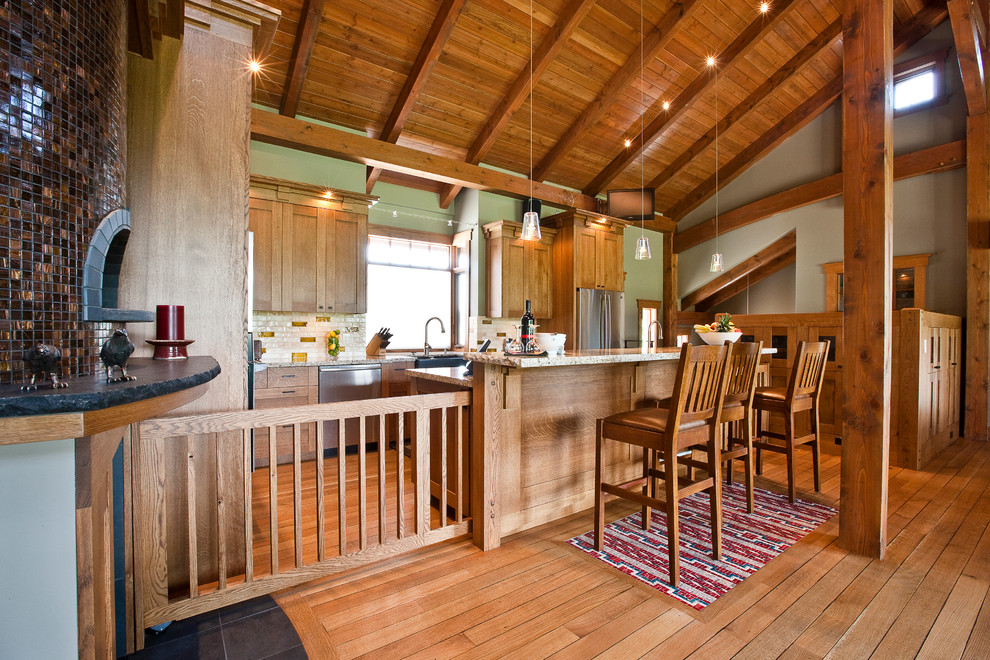Arts and crafts kitchen photo in Calgary with a farmhouse sink, medium tone wood cabinets, granite countertops, multicolored backsplash and stainless steel appliances
