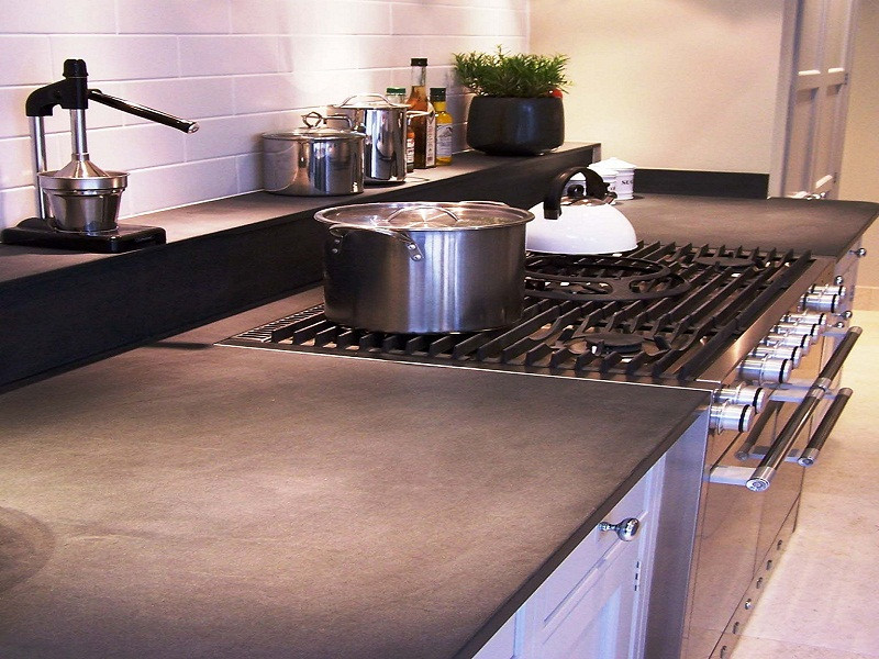 Inspiration for a rural kitchen in London with granite worktops and black worktops.