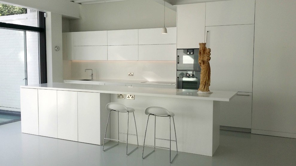 Inspiration for a contemporary kitchen in London with white cabinets, white splashback, integrated appliances and an island.
