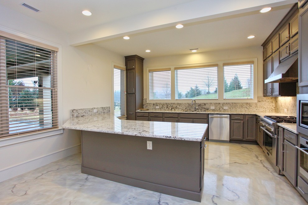 Large trendy u-shaped marble floor and white floor open concept kitchen photo in Raleigh with an undermount sink, shaker cabinets, granite countertops, beige backsplash, stainless steel appliances, an island, stone slab backsplash, multicolored countertops and gray cabinets