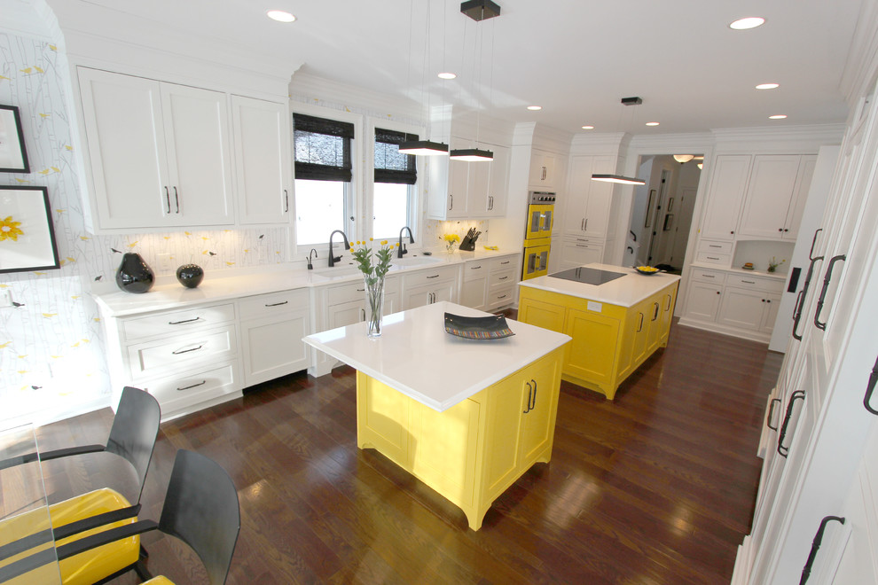 Huge transitional galley medium tone wood floor eat-in kitchen photo in Cleveland with an undermount sink, beaded inset cabinets, white cabinets, quartz countertops, multicolored backsplash, colored appliances and two islands