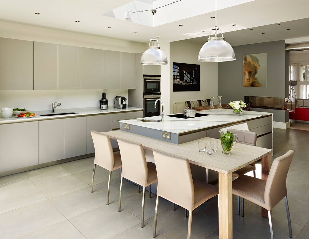 Design ideas for a contemporary kitchen in London with a single-bowl sink, flat-panel cabinets, grey cabinets and an island.