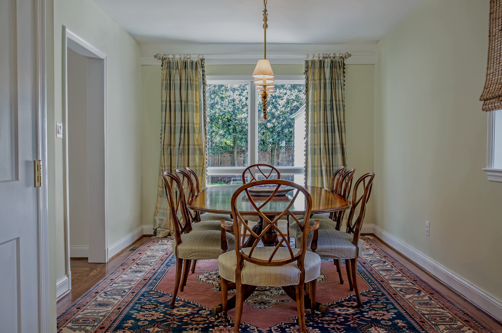 Photo of a medium sized traditional kitchen/dining room in DC Metro with medium hardwood flooring and brown floors.
