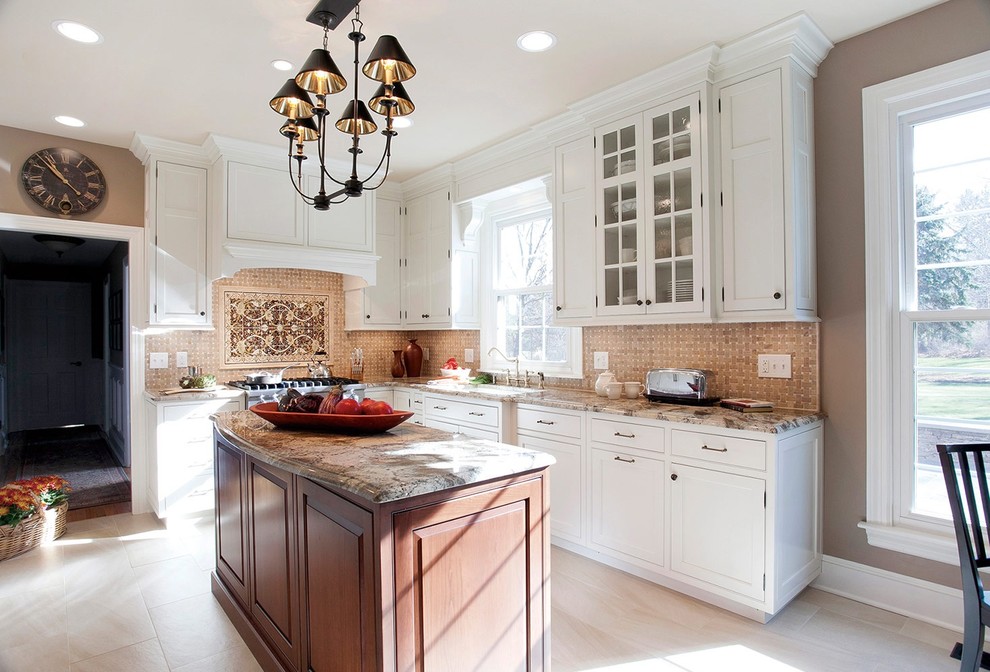 Inspiration for a mid-sized timeless l-shaped ceramic tile eat-in kitchen remodel in New York with an undermount sink, shaker cabinets, white cabinets, granite countertops, stone tile backsplash, stainless steel appliances, an island and beige backsplash